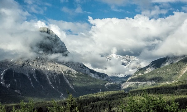 Photo Credit http://www.theuntappedsource.com/artwork/clouds-and-mist-over-canadian-rocky-mountain-peaks-by-gerda-grice/40804/